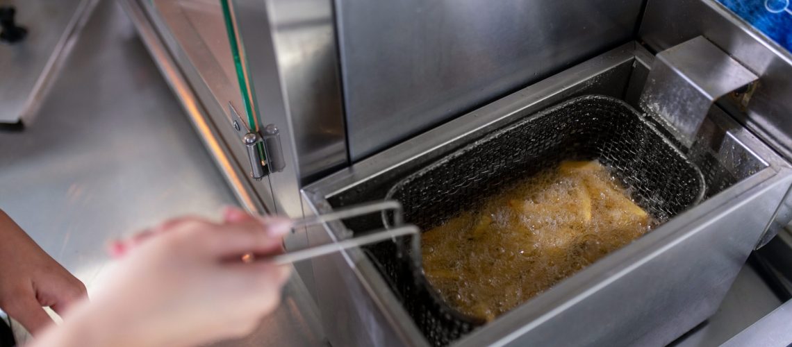 Cooking. Close up picture of hands stirring rice
