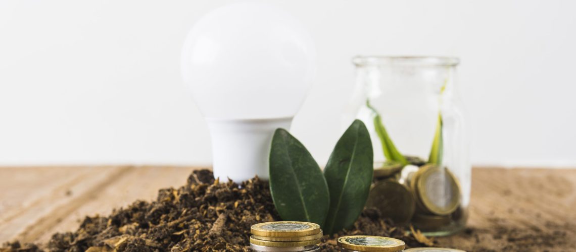 coins-stack-with-light-bulb-jar